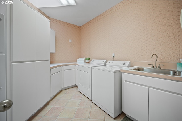 1421 SE 79th Ct, Vancouver, WA 98664 - laundry room featuring washing machine and dryer, cabinet space, wallpapered walls, and light tile patterned flooring