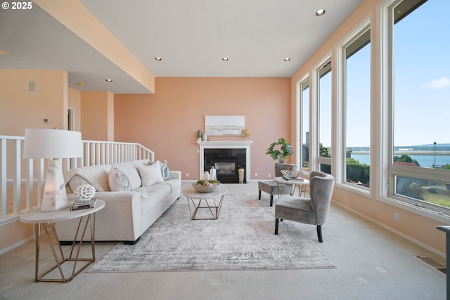 1421 SE 79th Ct, Vancouver, WA 98664 - carpeted living area featuring recessed lighting, a tile fireplace, and a water view