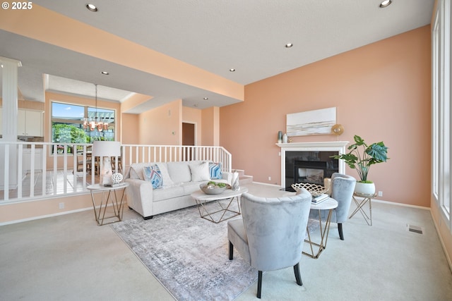 1421 SE 79th Ct, Vancouver, WA 98664 - living room with light colored carpet, a tiled fireplace, recessed lighting, and a chandelier