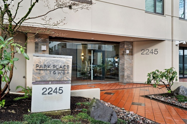 property entrance featuring stone siding