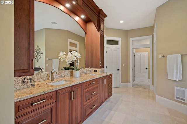 10000 NE 114th Cir, Vancouver, WA 98662 - full bathroom with double vanity, marble finish floors, baseboards, and recessed lighting