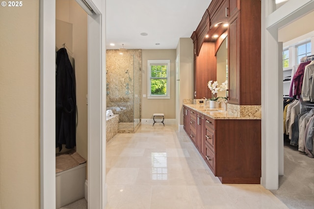 10000 NE 114th Cir, Vancouver, WA 98662 - bathroom featuring walk in shower, a spacious closet, vanity, baseboards, and a garden tub