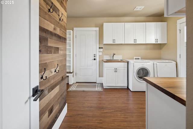 10000 NE 114th Cir, Vancouver, WA 98662 - laundry area featuring washing machine and clothes dryer, cabinet space, and dark wood-style floors