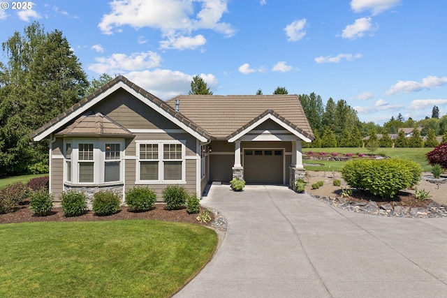 10000 NE 114th Cir, Vancouver, WA 98662 - view of front of house with stone siding, concrete driveway, an attached garage, and a front lawn