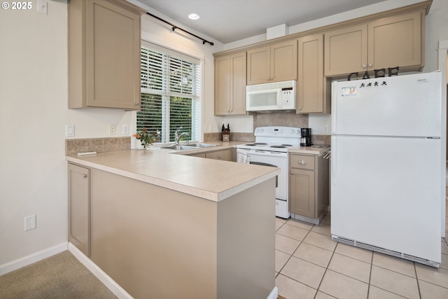 10000 NE 114th Cir, Vancouver, WA 98662 - kitchen featuring white appliances, a peninsula, a sink, light countertops, and light tile patterned floors