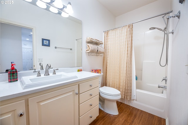 full bathroom with wood-type flooring, shower / bath combo, vanity, and toilet