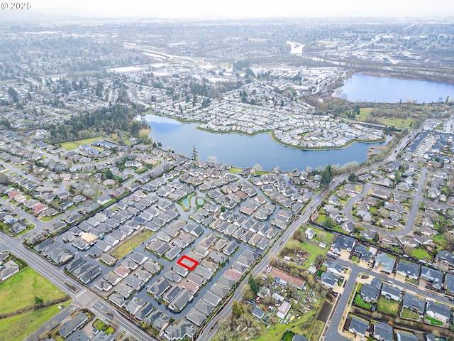 birds eye view of property featuring a water view