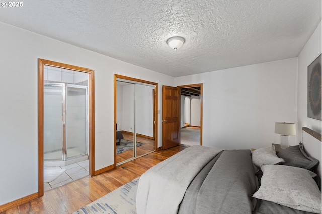 123 Scenic View Dr, Longview, WA 98632 - bedroom featuring light wood-style floors and a textured ceiling