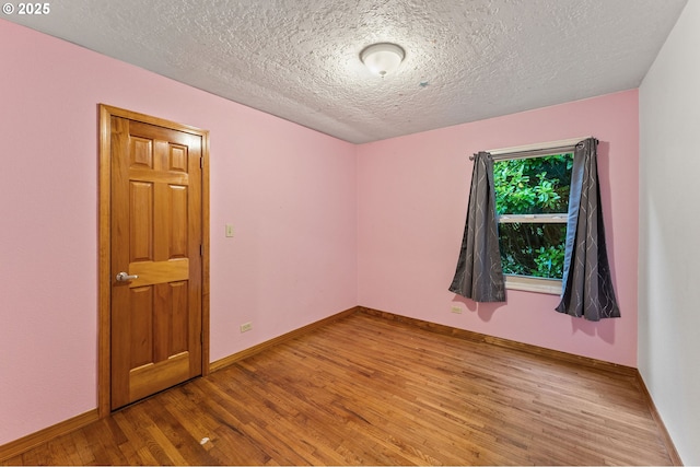 123 Scenic View Dr, Longview, WA 98632 - unfurnished room featuring wood finished floors and a textured ceiling