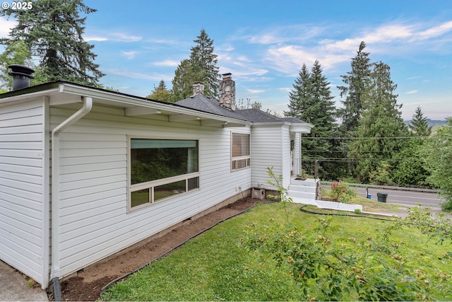 123 Scenic View Dr, Longview, WA 98632 - view of home's exterior featuring a chimney and a yard