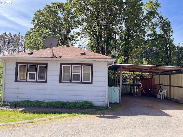 76464 High St, Oakridge, OR 97463 - view of property exterior featuring driveway and a shingled roof