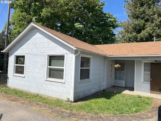 76464 High St, Oakridge, OR 97463 - view of side of home with a shingled roof