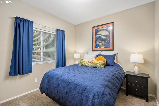 bedroom with carpet flooring and baseboards