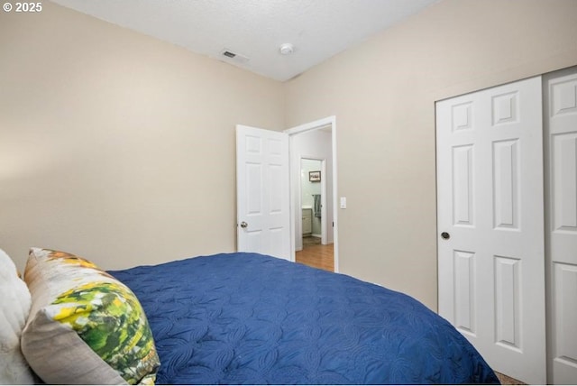 bedroom featuring visible vents