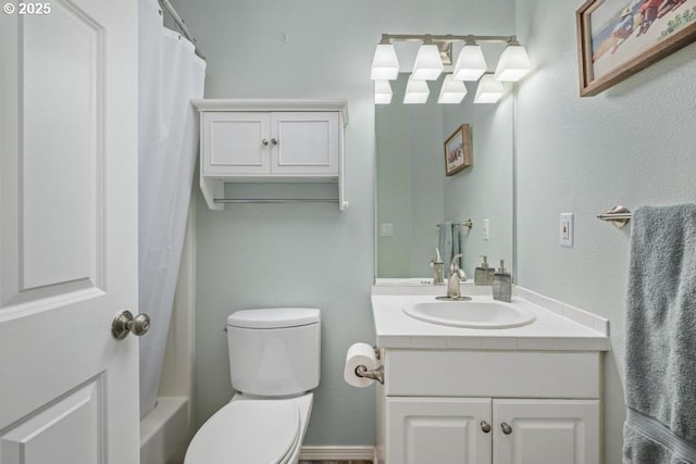 bathroom featuring toilet and vanity