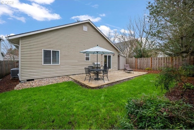 rear view of property with a patio area, a yard, fence, and crawl space