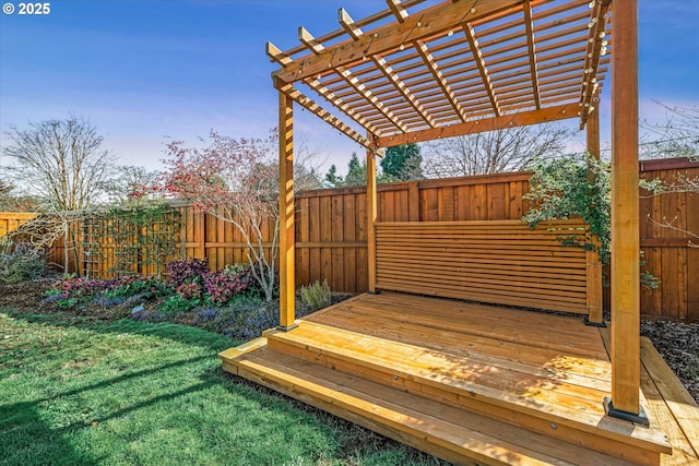 wooden terrace with a fenced backyard, a pergola, and a lawn