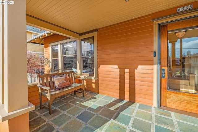 view of patio featuring a porch