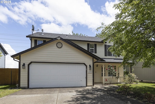 2907 NE 166th Pl, Vancouver, WA 98682 - traditional-style home with concrete driveway, covered porch, a garage, and a shingled roof