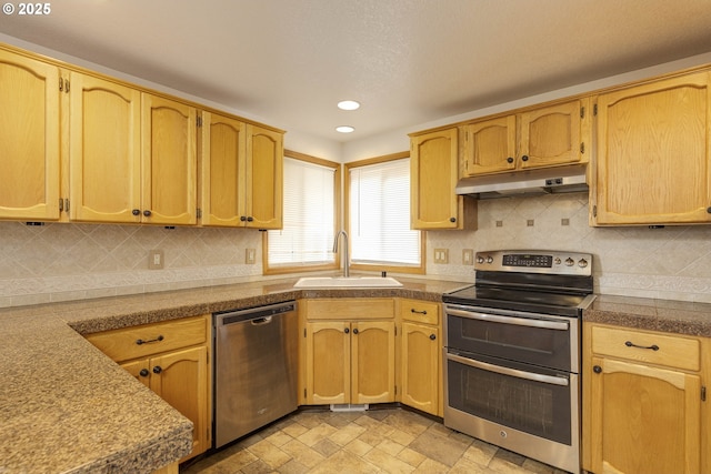 2907 NE 166th Pl, Vancouver, WA 98682 - kitchen with stainless steel appliances, a sink, under cabinet range hood, tile counters, and recessed lighting