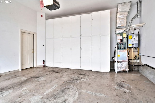 garage featuring water heater and a garage door opener