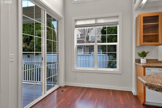 doorway with dark hardwood / wood-style flooring