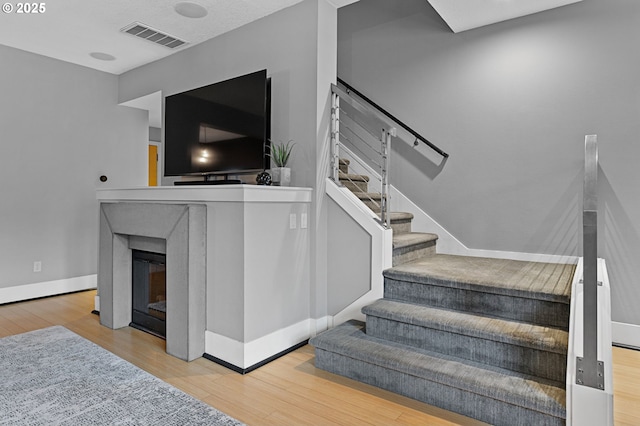 stairway with wood-type flooring