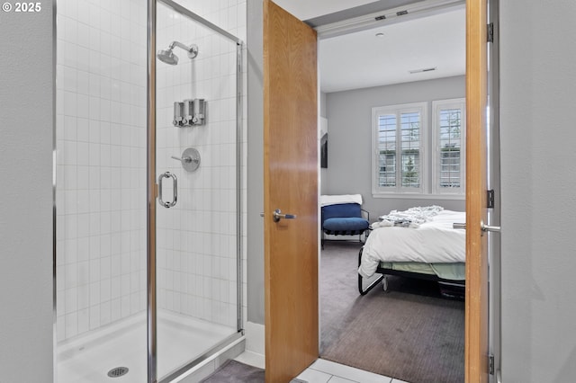 bathroom with a shower with shower door