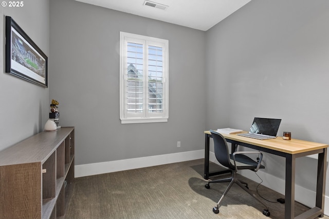 office space with dark colored carpet