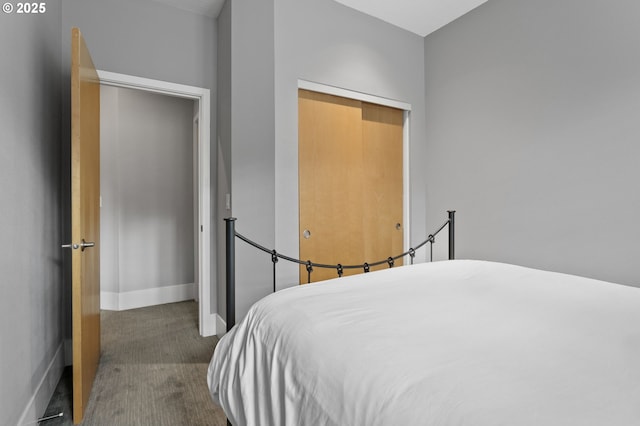 carpeted bedroom featuring a closet