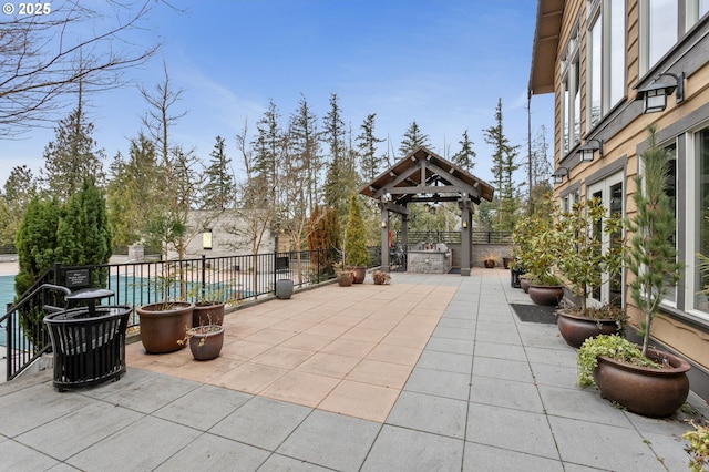 view of patio with a gazebo and a pool