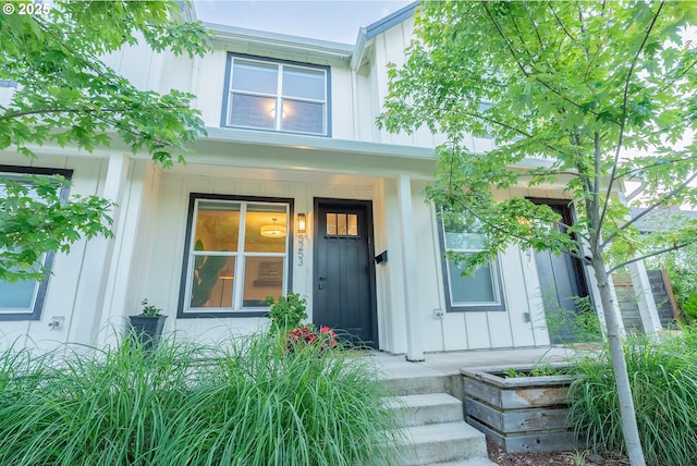 5253 NE 32nd Pl, Portland, OR 97211 - doorway to property featuring board and batten siding and covered porch