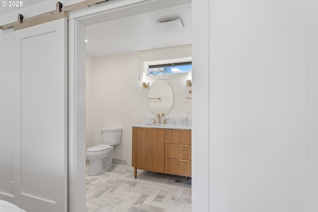 bathroom with vanity and toilet