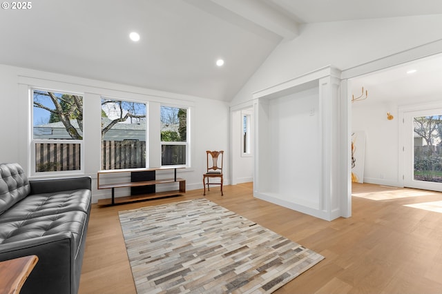 sitting room featuring lofted ceiling with beams, light wood finished floors, baseboards, and recessed lighting