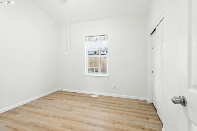 59673 Oak Ridge St, Saint Helens, OR 97051 - unfurnished bedroom with light wood-type flooring, a closet, and lofted ceiling