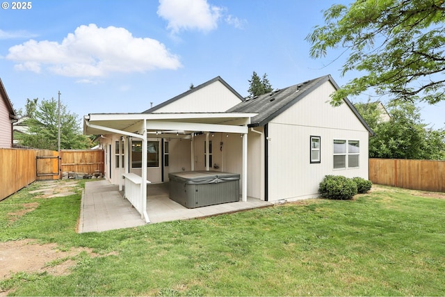 59673 Oak Ridge St, Saint Helens, OR 97051 - rear view of property with a hot tub, a patio, a fenced backyard, and a gate