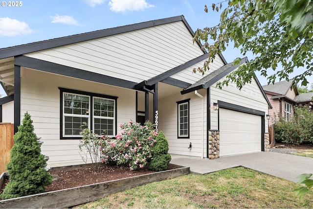 59673 Oak Ridge St, Saint Helens, OR 97051 - ranch-style home with a garage, concrete driveway, and covered porch