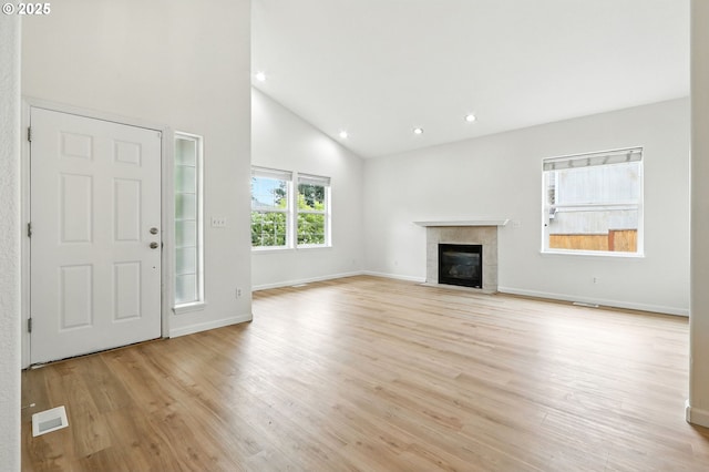 59673 Oak Ridge St, Saint Helens, OR 97051 - entryway featuring light wood finished floors, high vaulted ceiling, a tiled fireplace, and recessed lighting