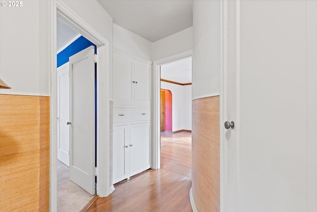 hall with wood-type flooring