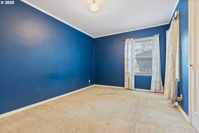 empty room with ornamental molding and carpet floors