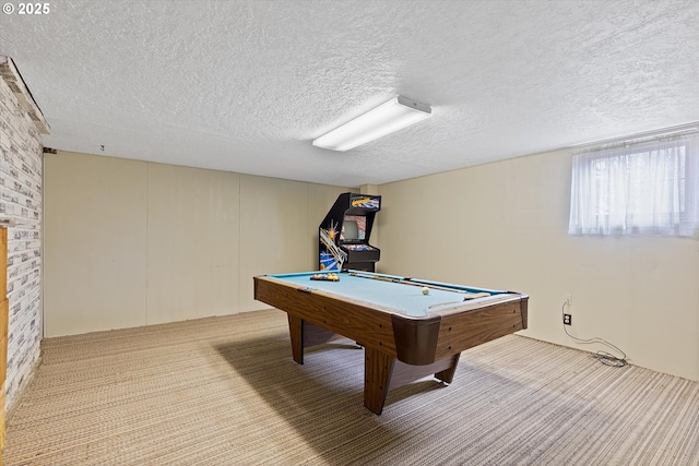 game room featuring billiards, light colored carpet, and a textured ceiling