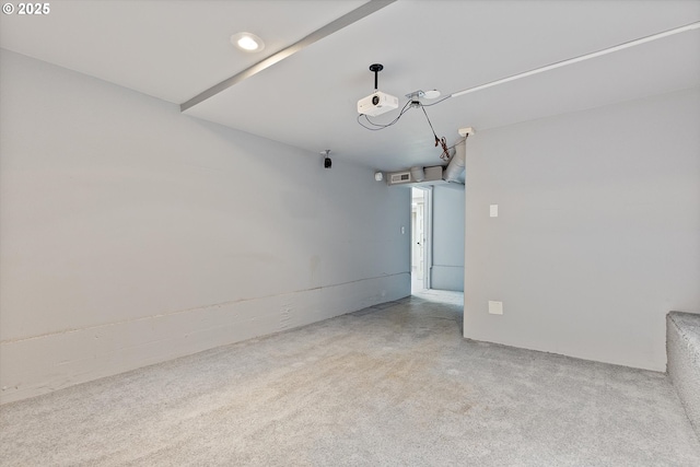 unfurnished room featuring light colored carpet