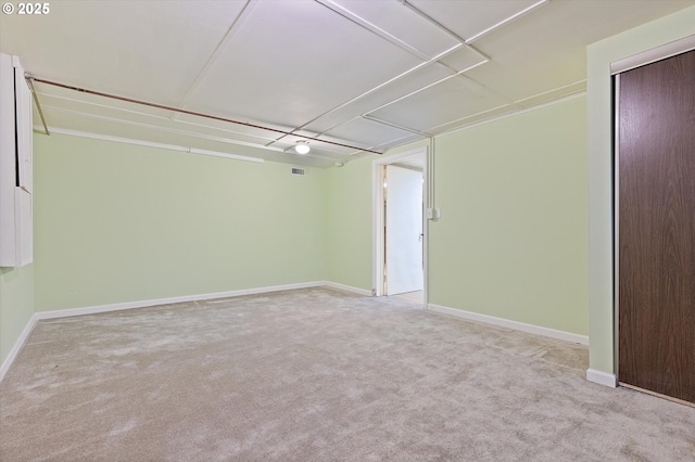 unfurnished room with light carpet