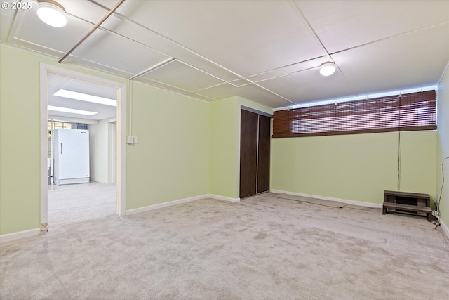 unfurnished room with light colored carpet