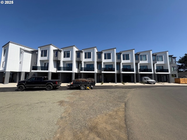 280 NW Huckleberry St, Waldport, OR 97394 - view of property featuring uncovered parking and a residential view
