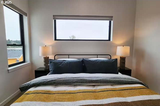 280 NW Huckleberry St, Waldport, OR 97394 - bedroom featuring baseboards