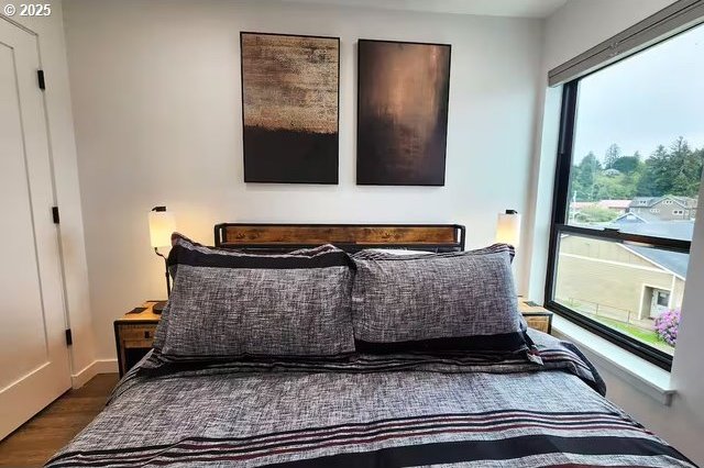 280 NW Huckleberry St, Waldport, OR 97394 - bedroom featuring wood finished floors