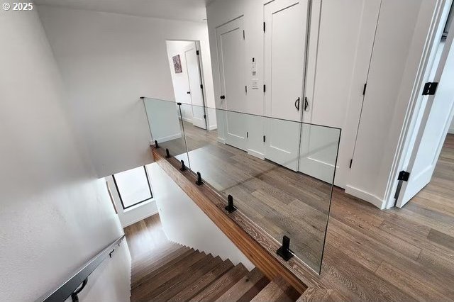 280 NW Huckleberry St, Waldport, OR 97394 - staircase featuring wood finished floors