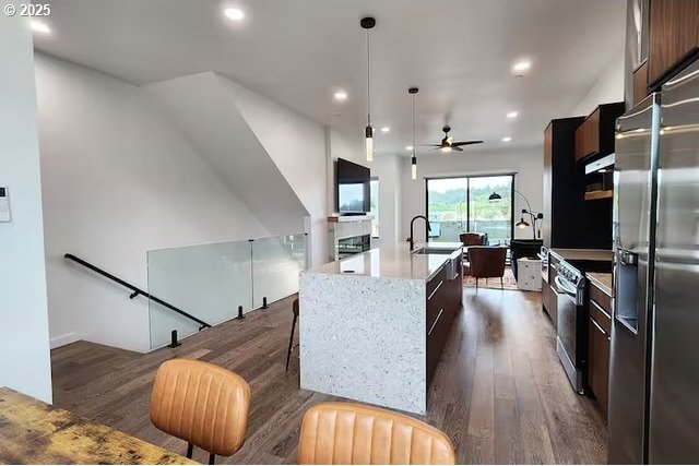 280 NW Huckleberry St, Waldport, OR 97394 - kitchen with appliances with stainless steel finishes, modern cabinets, light wood-style flooring, ceiling fan, and recessed lighting