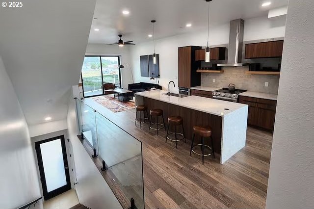 280 NW Huckleberry St, Waldport, OR 97394 - kitchen featuring modern cabinets, electric stove, light countertops, wood finished floors, and recessed lighting